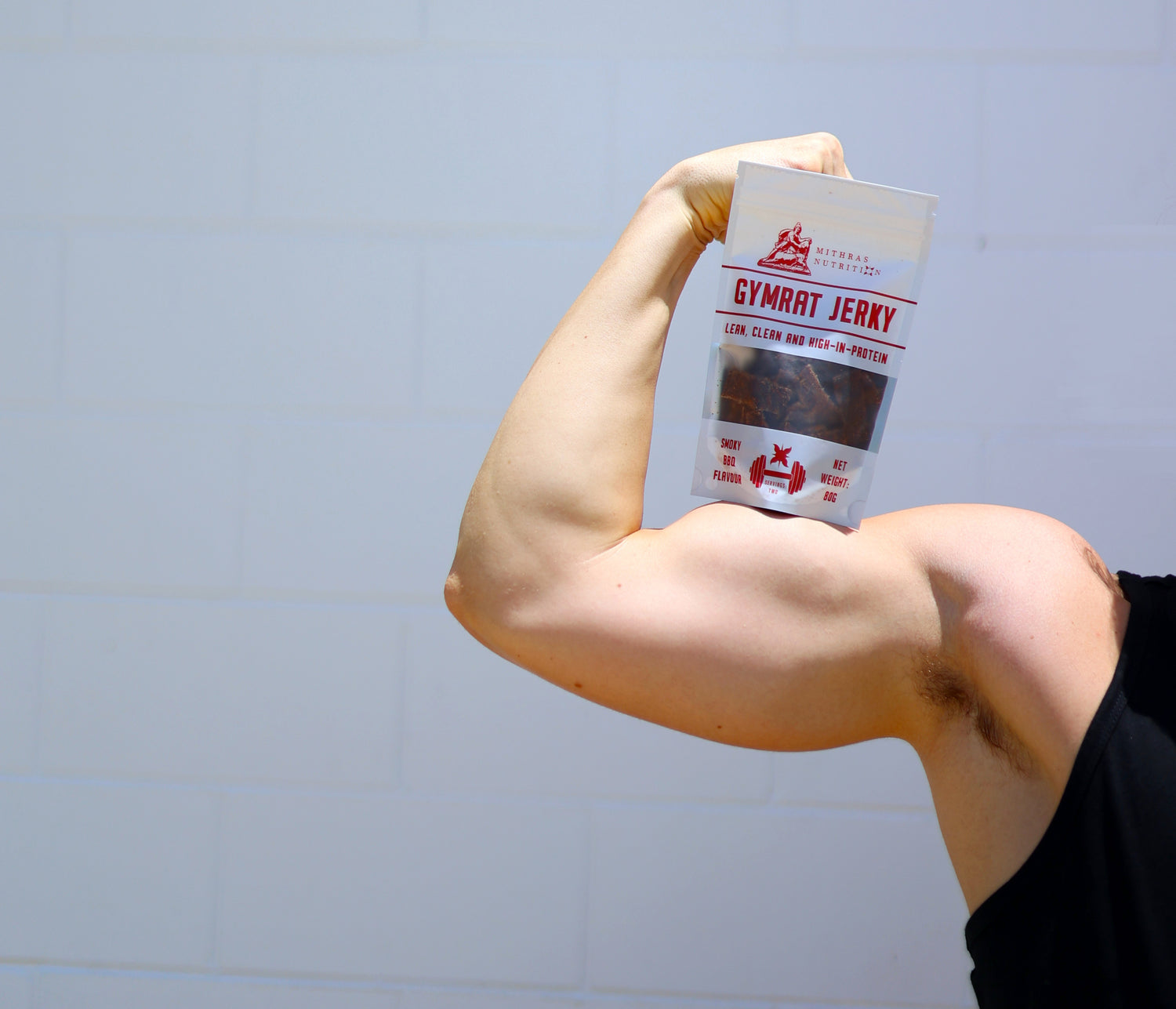 Image of Gymrat Jerky high protein beef jerky Australia with bicep