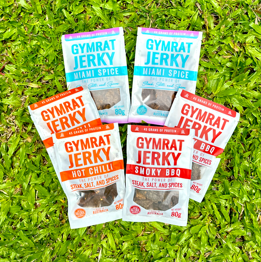 Gymrat Jerky packages on grass
